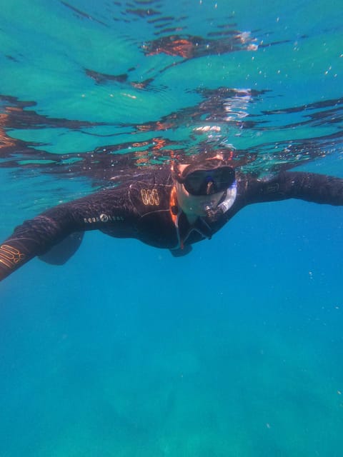 Chania: Boat Trip with Guided Snorkeling Tour - Between stops: snacks, water, and a breather on board