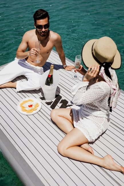 Dia: Day & Sunset Cruise with Menu by Greece's Top 100 Chef - The Dia Island block: photos, swimming, snorkeling, SUP, fishing, and chill time