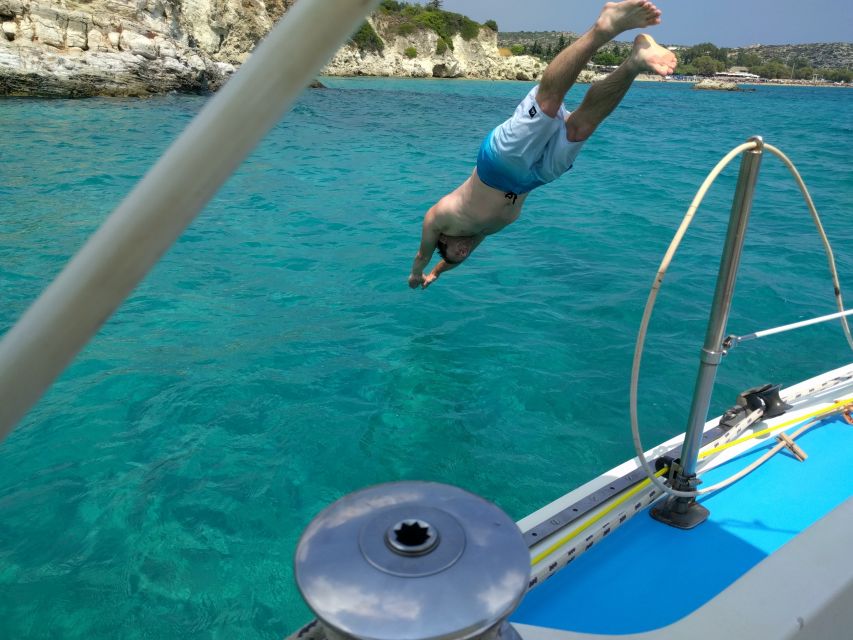 From Chania: Fully Private Sailing Cruise with Meal & Drinks - Ai Giannis Beach: the first anchor-and-swim moment plus chapel photos