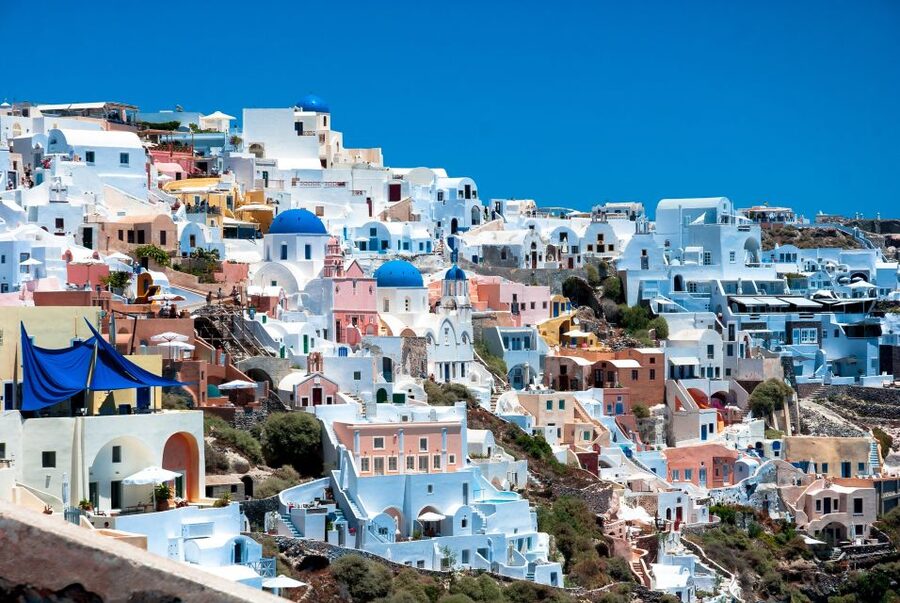 Heraklion or Ag Nikolaos: Oia & Fira Full-Day Santorini Trip - Fira in the late day: shopping time with volcano backdrop energy