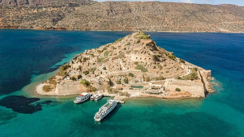 Heraklion: Spinalonga, Agios Nikolaos, & Elounda Tour - Kolokytha Beach: sand, blue water, and a BBQ lunch that actually feeds you