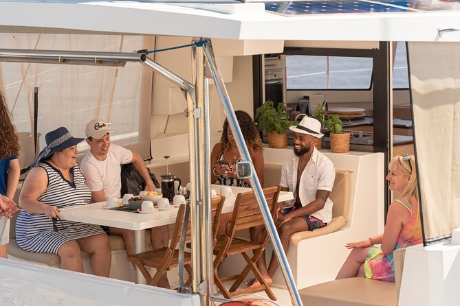 Hersonissos: Luxury Sunset Catamaran Cruise Sushi & Open Bar - Saint George Bay and the cliff backdrop: the scenery you’re actually buying