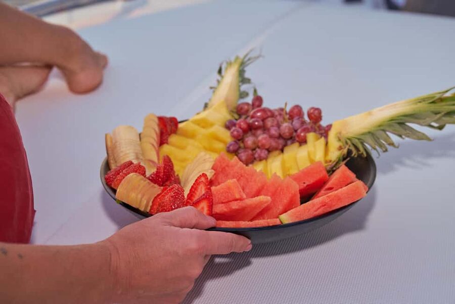 Kissamos: Catamaran Balos Sunset Cruise with Sushi & Drinks - Sushi, Fruit, and Drinks as the Sky Starts to Turn