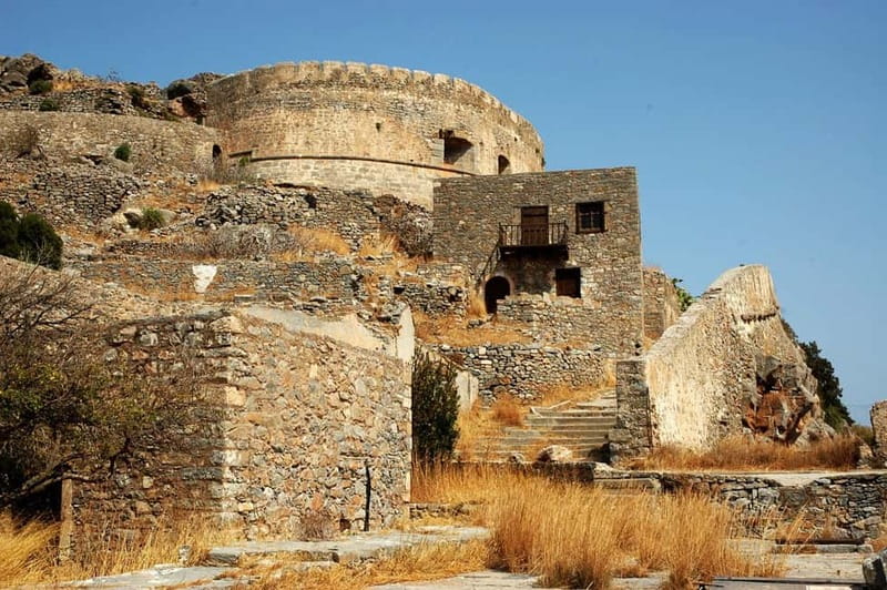 Minicruise: Spinalonga Island, Pirate Caves & Hidden Beaches - Onboard hot dogs, fruit, wine, and raki: snack-lunch honesty